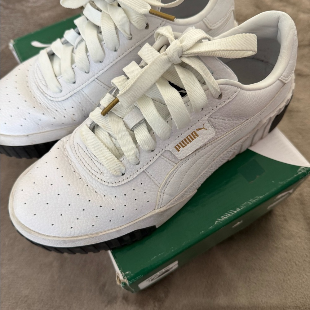 Puma White Leather Sneakers with Black Sole and Gold Logo